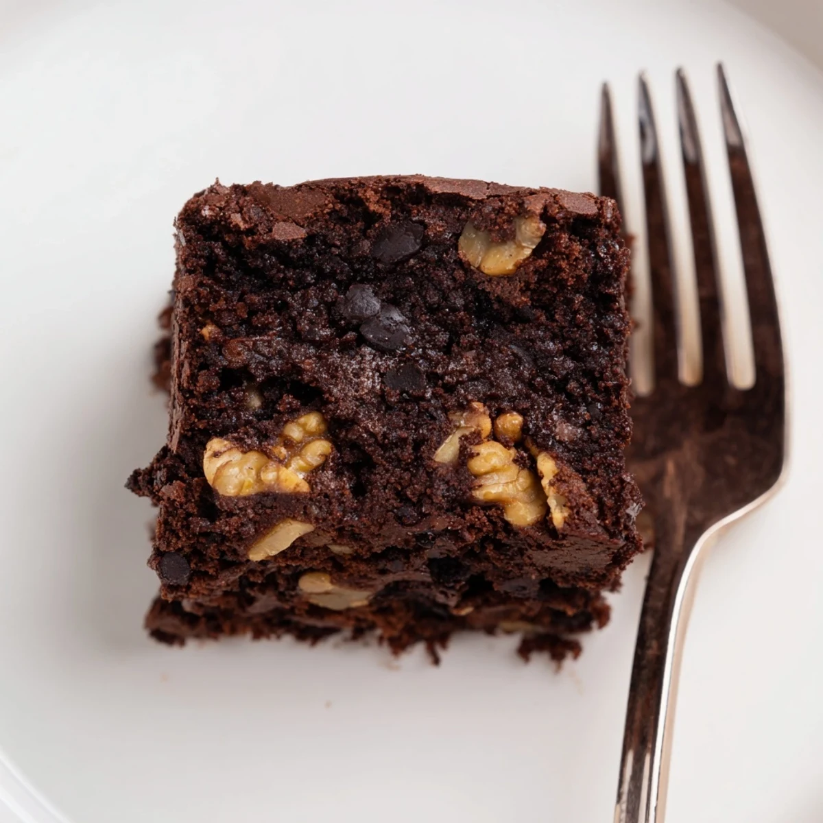 Decadent zero-waste brownies using nut-milk pulp, topped with dark chocolate chips.  