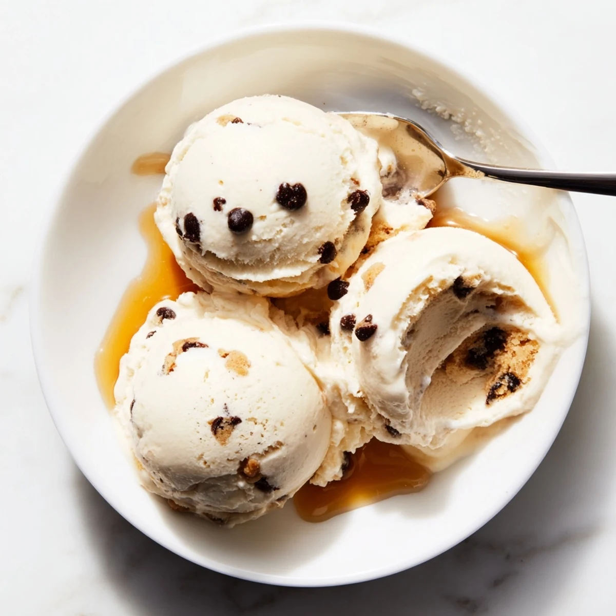 Creamy cottage cheese ice cream topped with edible cookie dough and chocolate chips.  