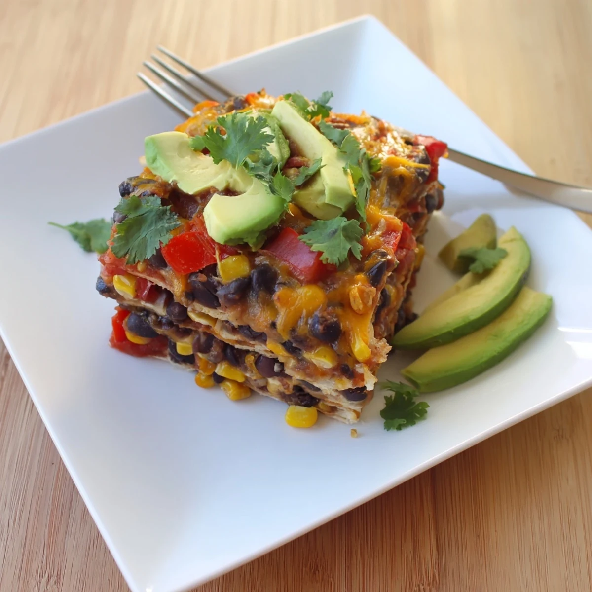 Quick Black Bean and Corn Tortilla Casserole bubbling with melted cheese, perfect for a busy weeknight meal.