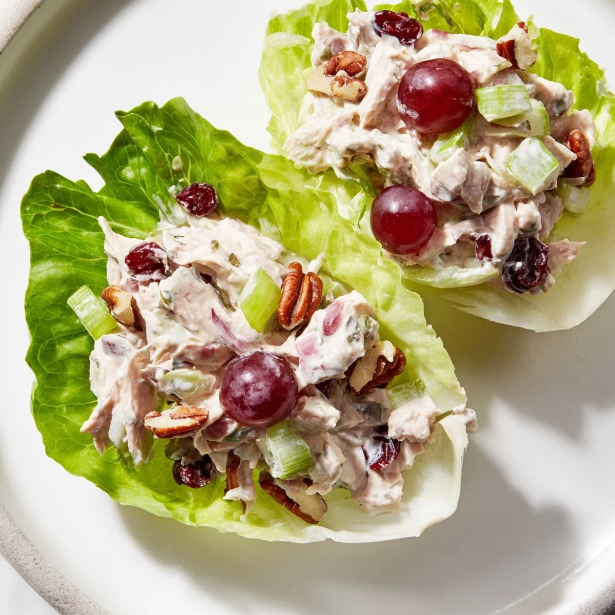 Enjoy the refreshing crunch of lettuce and the creamy filling of these gorgeous Festive Chicken Salad Cups.