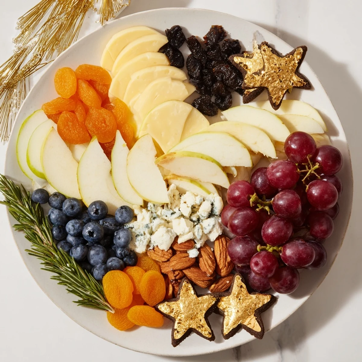 A beautifully arranged Moon & Stars Night Board with cheeses, fruits, and star-shaped crackers.