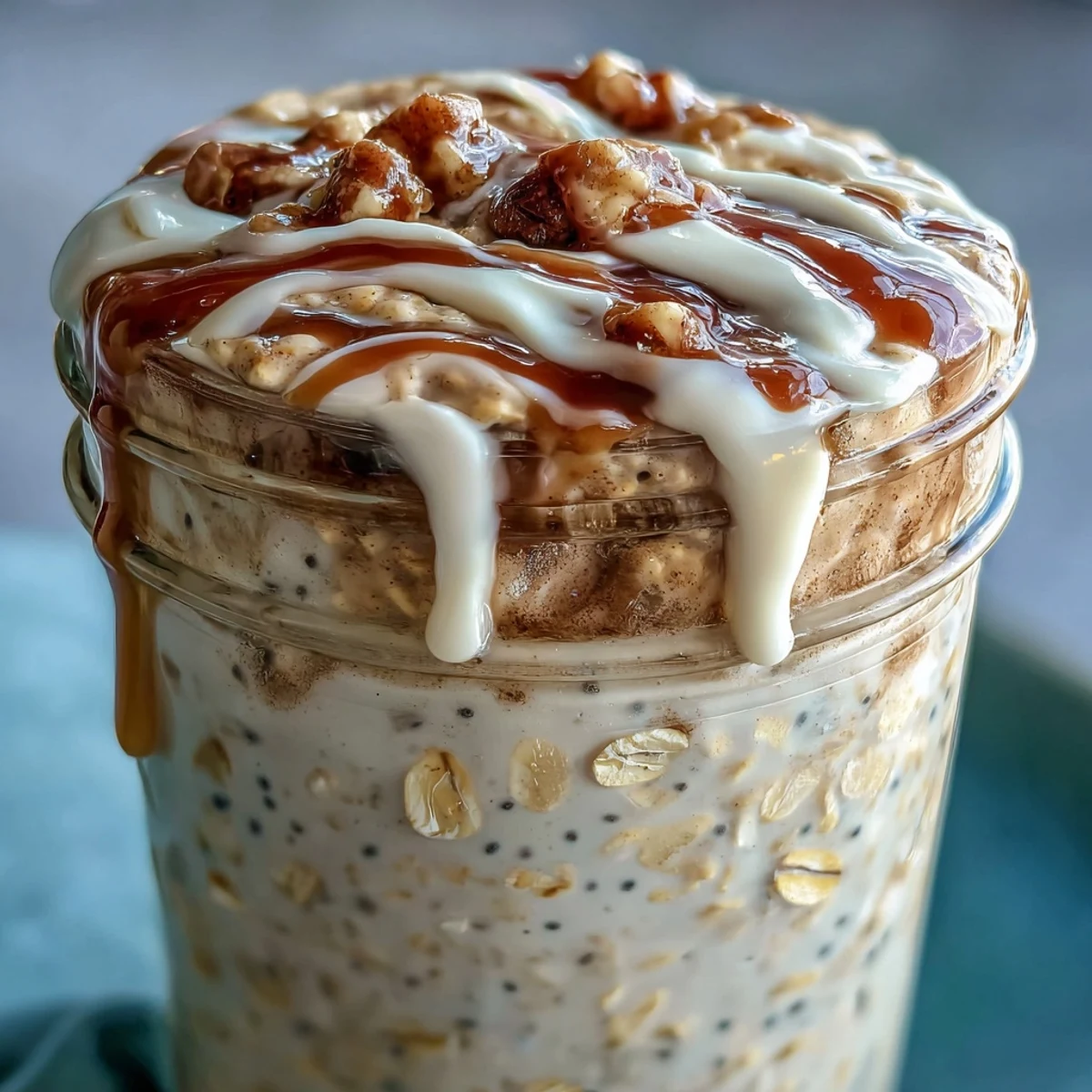 High-Protein Cinnamon Roll Overnight Oats layered with Greek yogurt and oats for a healthy breakfast. 