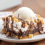 Indulge in S’mores Soda Float Brownies with root beer, chocolate, and creamy layers.  