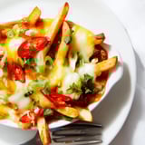 Savory Honey Sriracha Casserole Fries bathed in a spicy-sweet sauce and gooey cheese.  