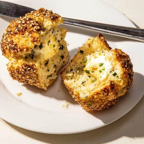 Fluffy cream cheese everything bagel muffins topped with savory seasoning and sesame seeds.  
