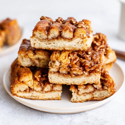 Buttery cinnamon sugar maple bourbon flaky pretzel biscuit bars with crunchy topping.  