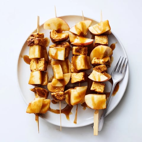Delicious Caramel Apple Chai Pumpkin Pancake Muffin Skewers drizzled with warm caramel sauce.