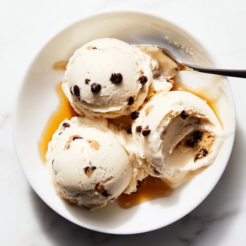 Creamy cottage cheese ice cream topped with edible cookie dough and chocolate chips.  