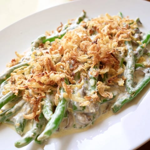 Creamy Old-School Green Bean Casserole with golden crispy onions, perfect for a cozy Thanksgiving.