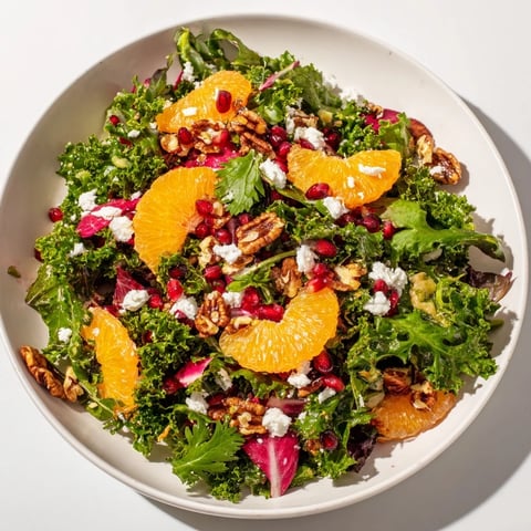 Winter Greens Salad with Citrus: A close-up of the fresh ingredients, anticipating bright, juicy flavors.