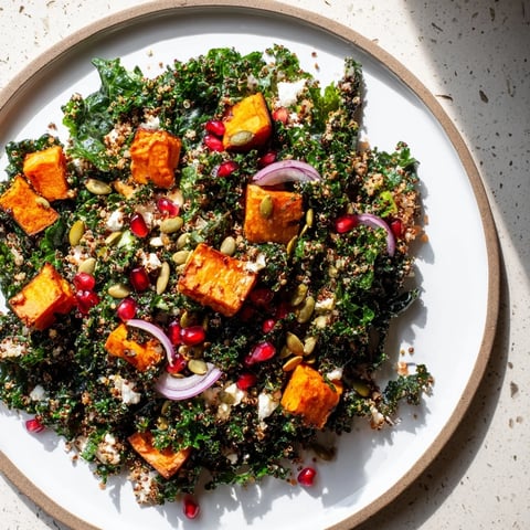 Vibrant Kale & Quinoa Salad with Lemon Dressing, featuring roasted sweet potatoes, a colorful and healthy meal.