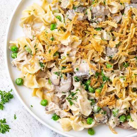 Golden brown Tuna Noodle Casserole with a crispy onion topping, perfect for weeknight meals.