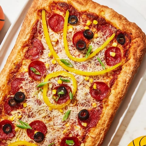 Freshly baked Basketball Court Pizza with a crispy crust and melted mozzarella.