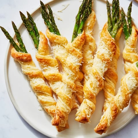 Golden-brown Star Shaped Asparagus Bundle Wraps, a flaky appetizer bursting with savory asparagus flavor.