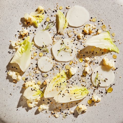 The chilled "Tundra Trek" appetizer features crisp vegetables artfully arranged on a cold platter.