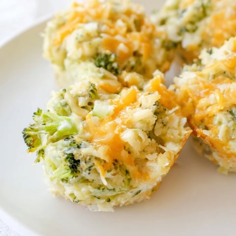 Golden-brown Cheesy Broccoli Casserole Bites, filled with melted cheese, ready to eat.