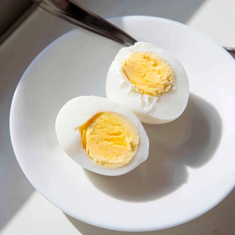 Air fryer boiled eggs, golden and ready for a breakfast of champions, perfectly cooked.