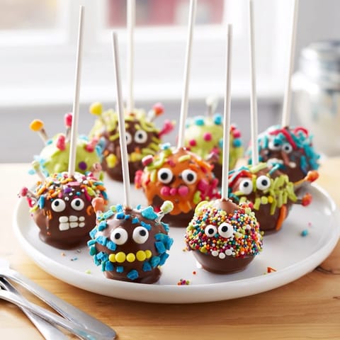 Delicious salted caramel monster cake pops, perfect for festive Halloween treats or parties.  