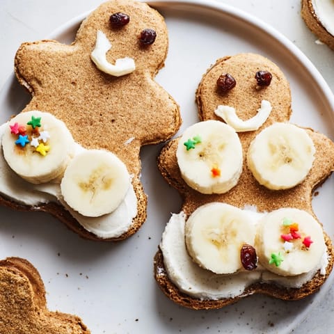 Delicious gingerbread man sandwich cutouts, the cream cheese filling is perfect with sweet fruits.