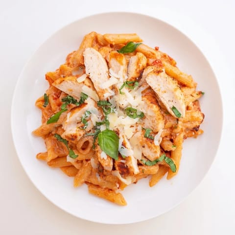 A creamy plate of Creamy Tomato Basil Chicken Pasta, showcasing tender chicken and vibrant sauce.