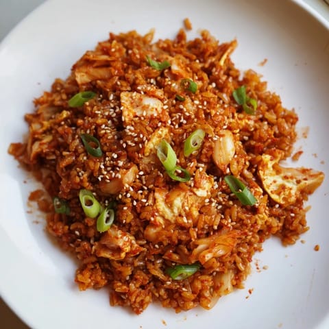 Golden-brown Spicy Kimchi Fried Rice with fluffy rice and visible kimchi pieces, ready to be devoured.