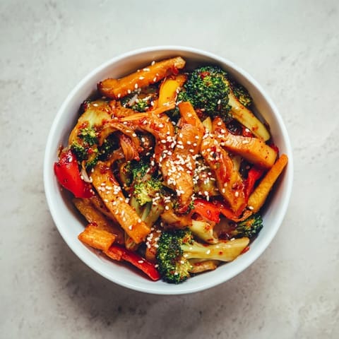 A close-up of the finished Comforting Fermented Veggie Winter Stir-Fry topped with sesame seeds.