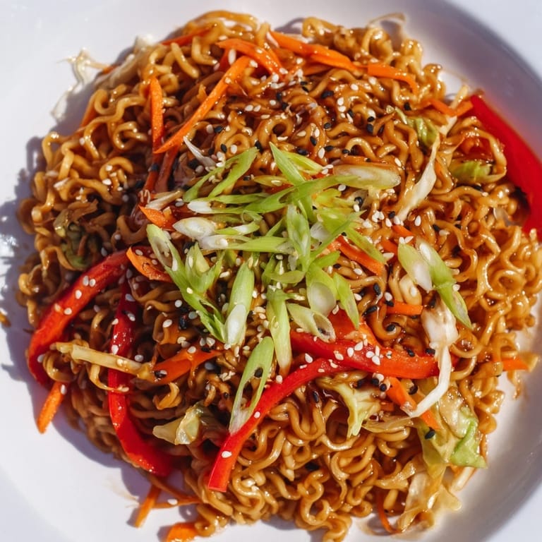 Vibrant photo of the spicy ramen stir fry, featuring crisp vegetables and savory sauce for dinner.