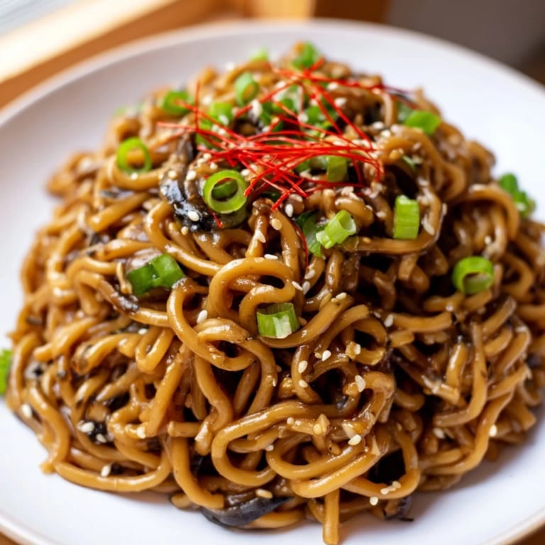 Enjoy a quick and easy Asian Garlic Noodle Bowl, a flavorful vegetarian main course, ready to savor.
